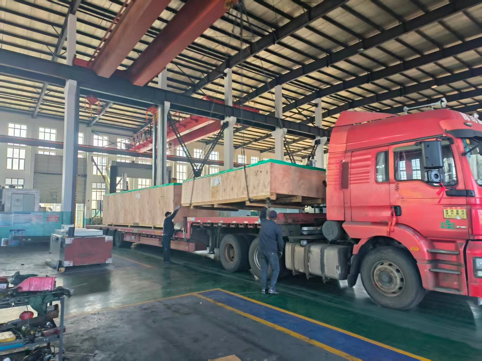 Loading packed machinery at the production facility